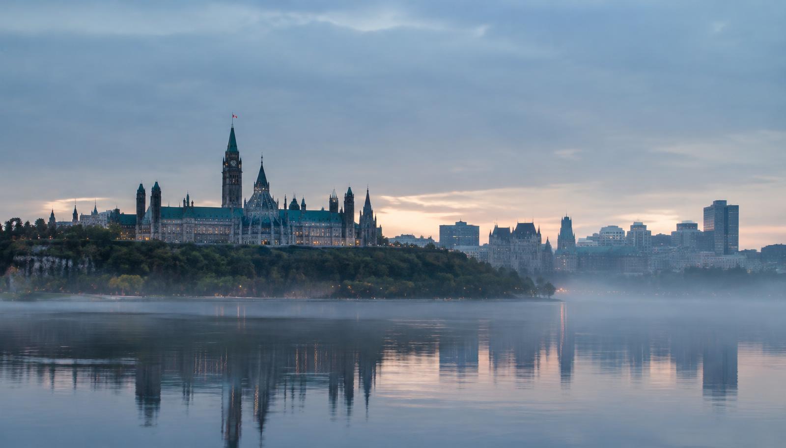 Ottawa skyline over the river at dawn